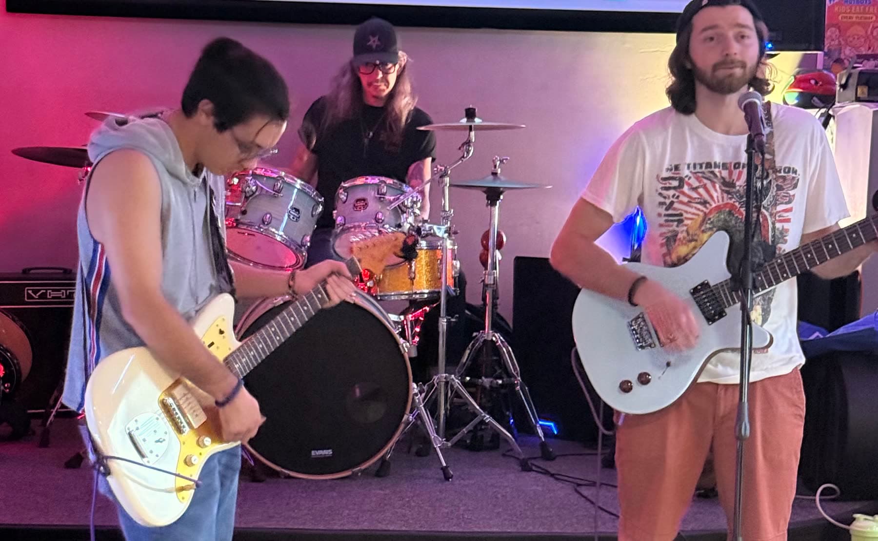 The Club on stage: guitar, drums and vocals